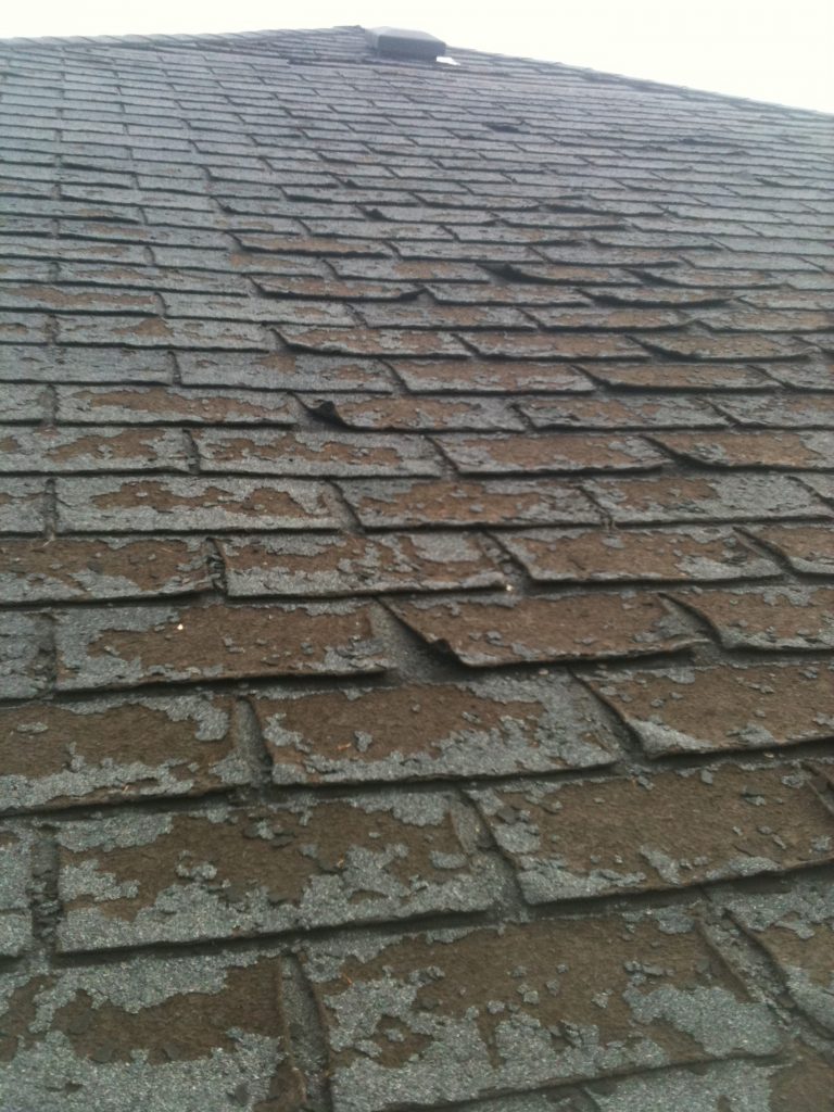 curling shingles with missing granules
